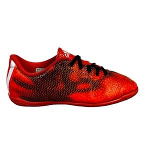 adidas orange and Black boys soccer shoes